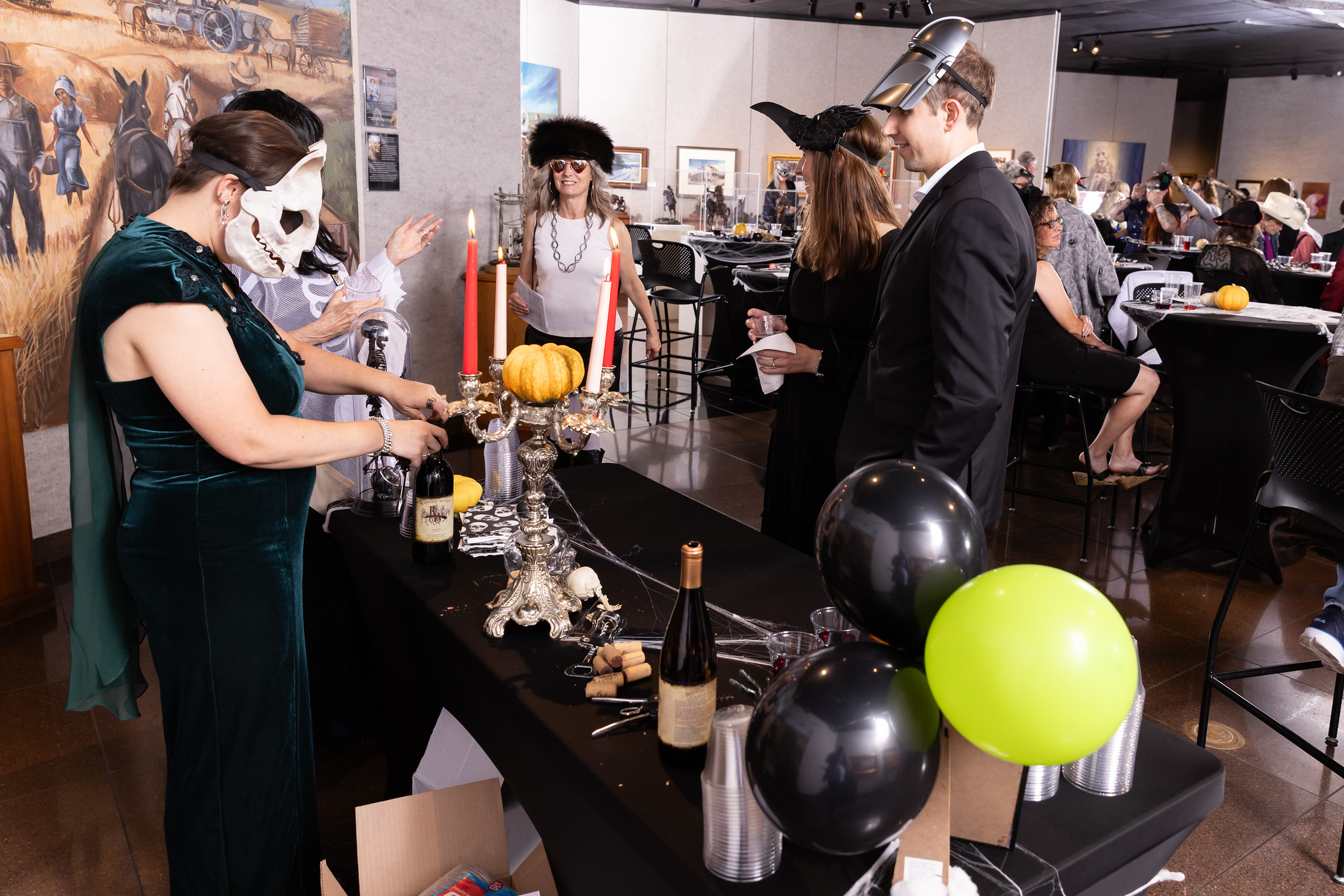 guests get a drink at a costume party