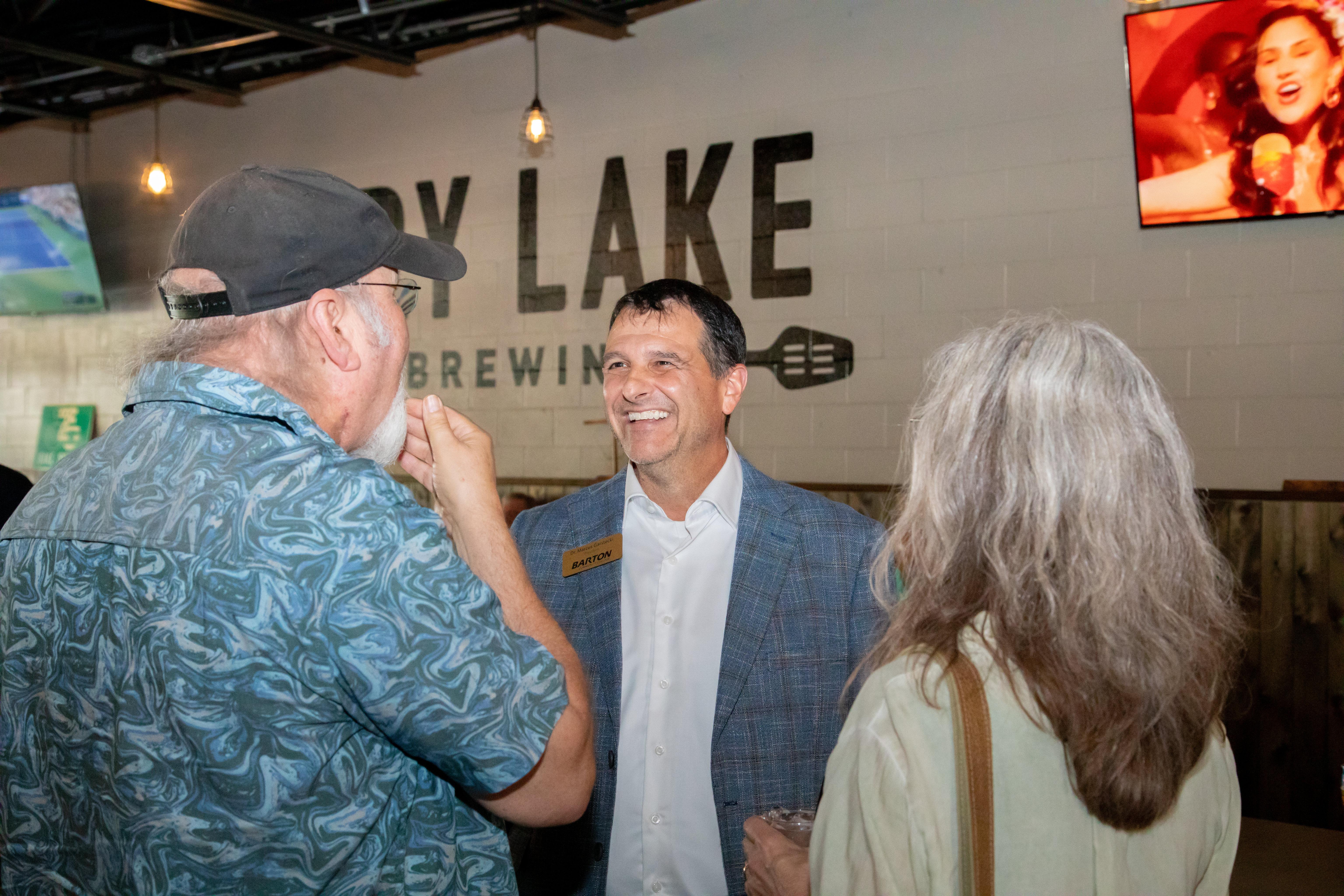 Dr. Marcus Garstecki meets community members during the recent social event